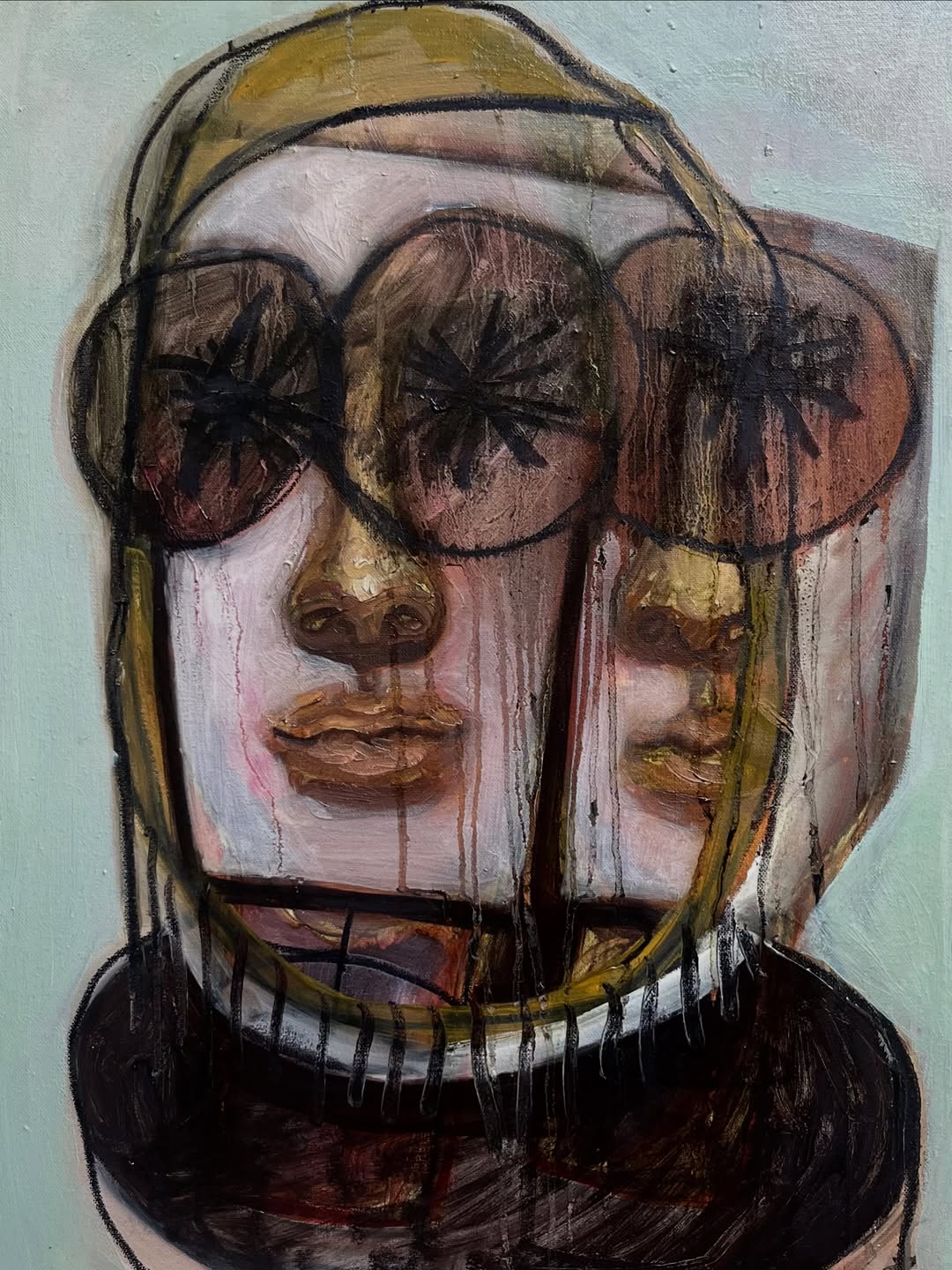 Layered portrait in pale blue, ochre and charcoal, with overlapping faces and dark eyes.